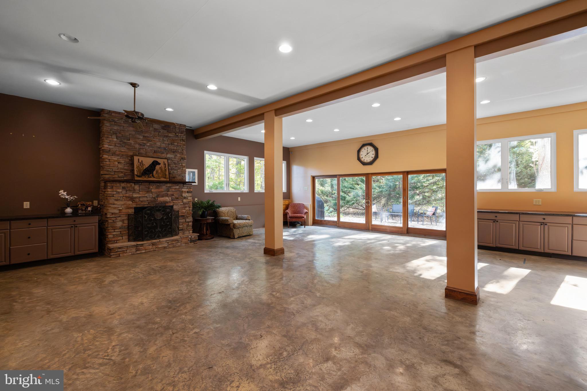 719 Mission Road Harpers Ferry, WV 25425 - Photo 5 of 37 a view of an empty room with a fireplace and a large window
