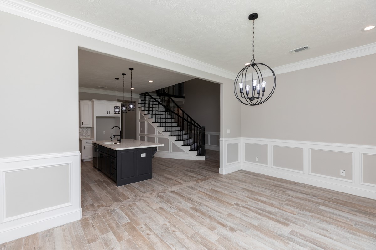 7705 Water Edge Beaumont, TX 77707 - Photo 12 of 39 a view of a living room with wooden floor and furniture