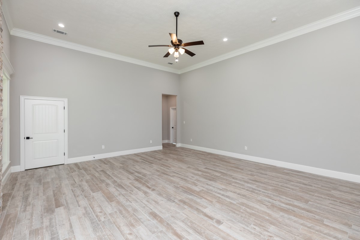 7705 Water Edge Beaumont, TX 77707 - Photo 13 of 39 wooden floor in an empty room with a window