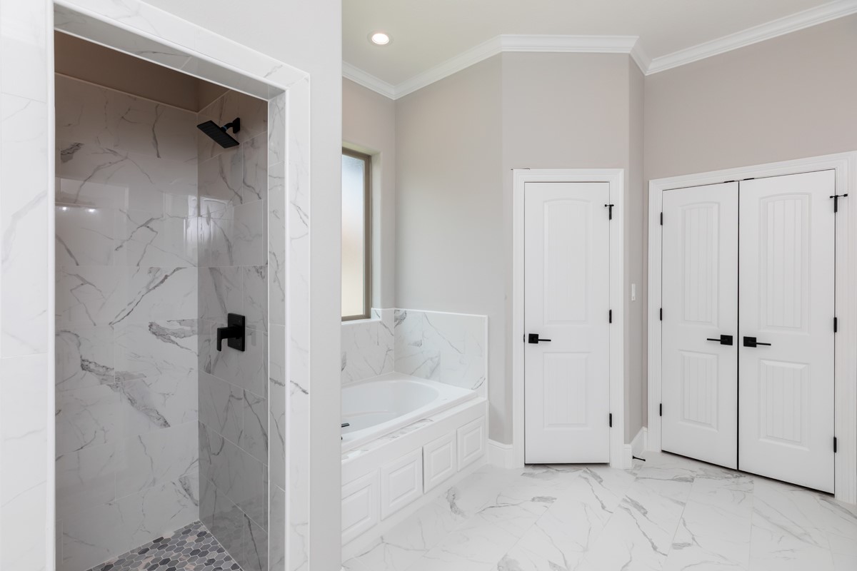 7705 Water Edge Beaumont, TX 77707 - Photo 21 of 39 a bathroom with a tub shower and sink