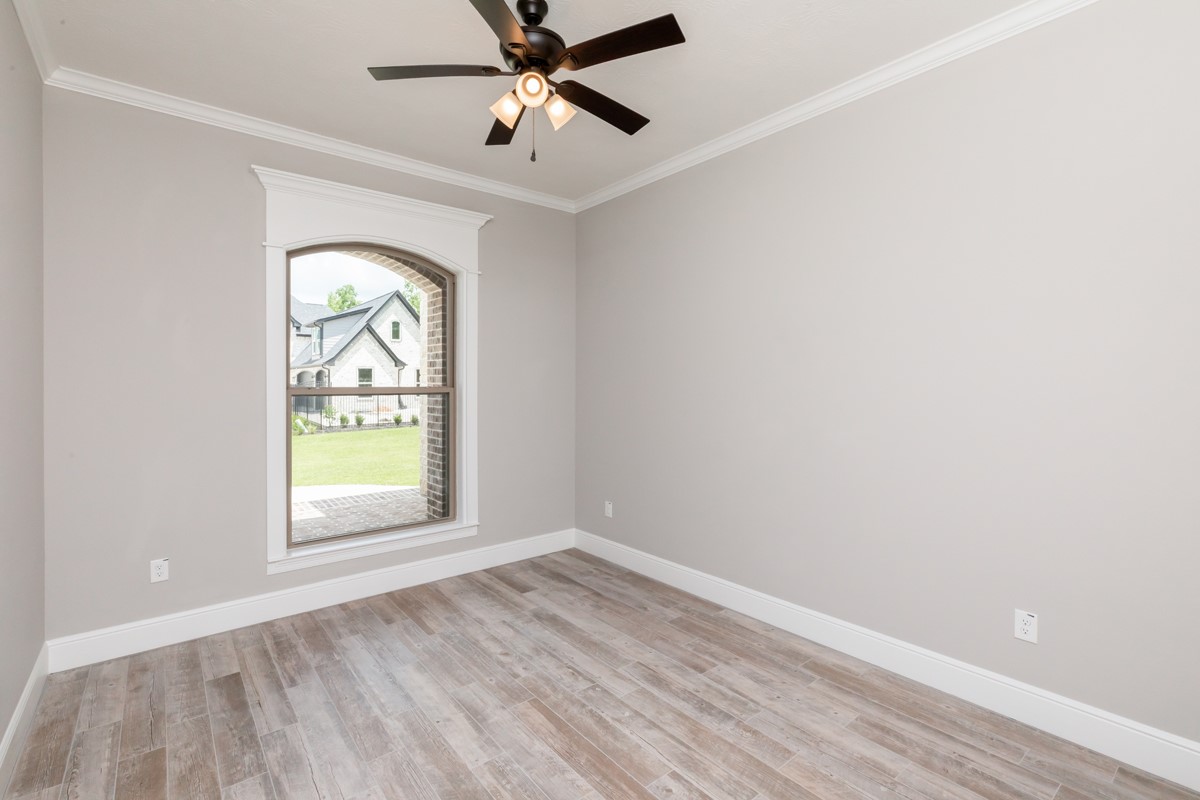 7705 Water Edge Beaumont, TX 77707 - Photo 24 of 39 an empty room with a window and ceiling fan