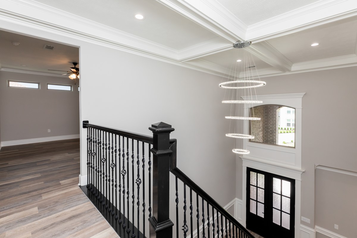 7705 Water Edge Beaumont, TX 77707 - Photo 29 of 39 a view of a hallway with wooden floor and staircase