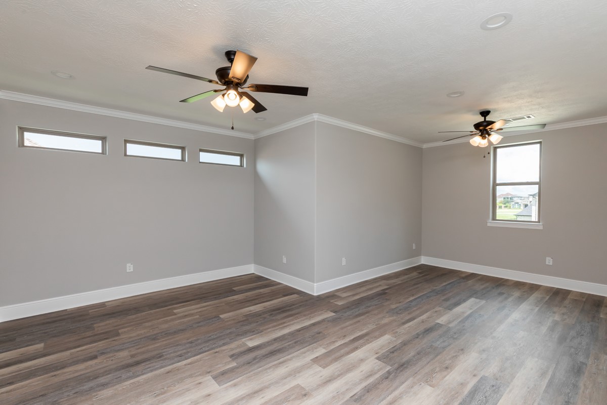 7705 Water Edge Beaumont, TX 77707 - Photo 30 of 39 wooden floor in an empty room with a window