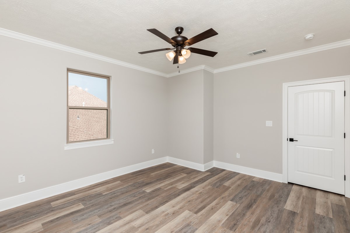 7705 Water Edge Beaumont, TX 77707 - Photo 32 of 39 wooden floor in an empty room with a window