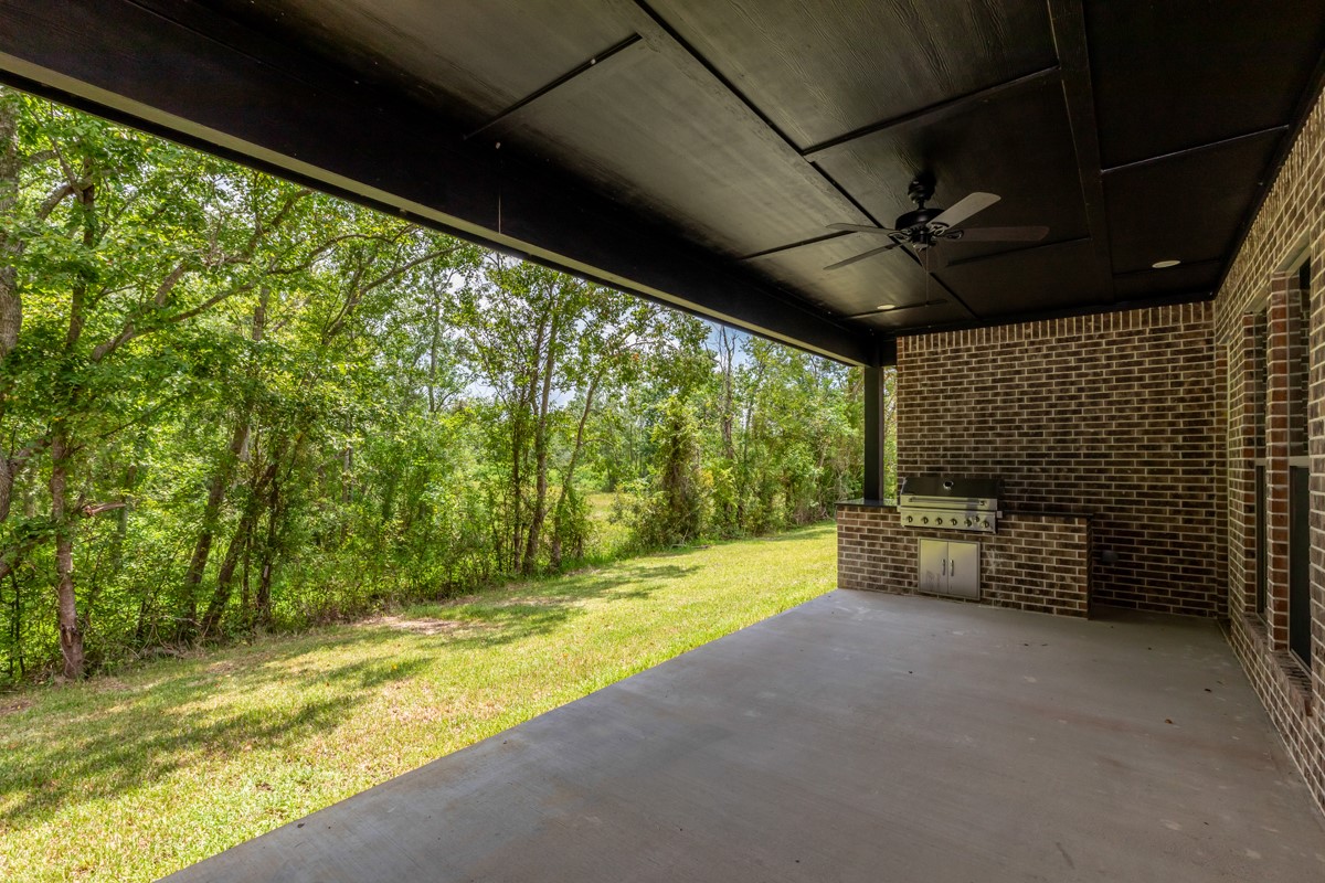 7705 Water Edge Beaumont, TX 77707 - Photo 35 of 39 a view of swimming pool with a table and chairs under an umbrella
