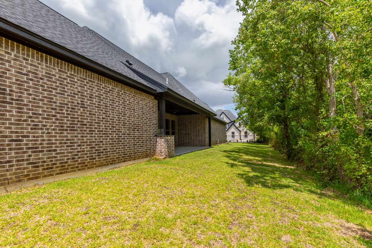 7705 Water Edge Beaumont, TX 77707 - Photo 37 of 39 a backyard of a house with large trees