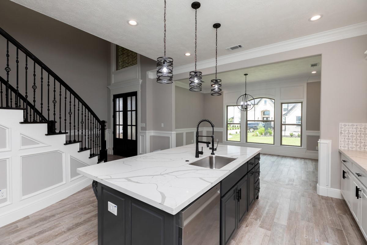 7705 Water Edge Beaumont, TX 77707 - Photo 8 of 39 a kitchen with sink and refrigerator