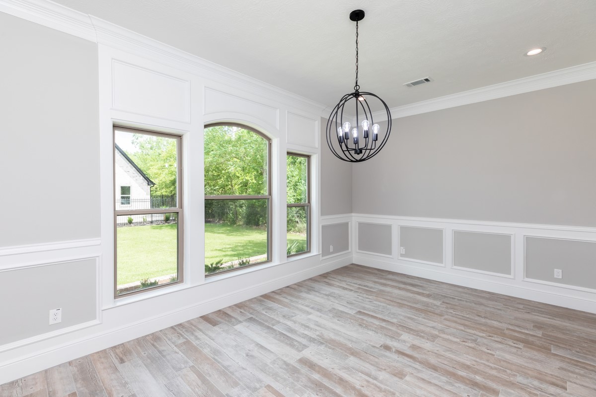 7705 Water Edge Beaumont, TX 77707 - Photo 10 of 39 a view of empty room with wooden floor and fan