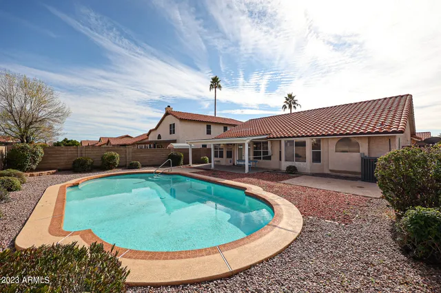 a view of a house with swimming pool