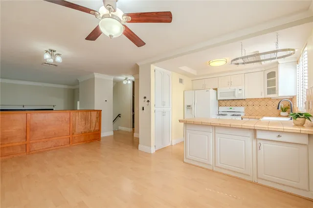 a view of a kitchen with a sink and cabinet area