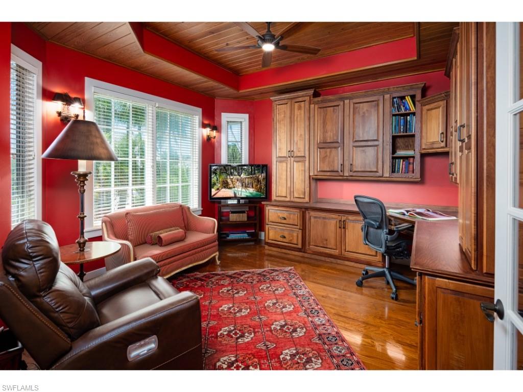 263 10th Avenue South Naples, FL 34102 - Photo 6 of 18 a living room with furniture a rug and a floor to ceiling window