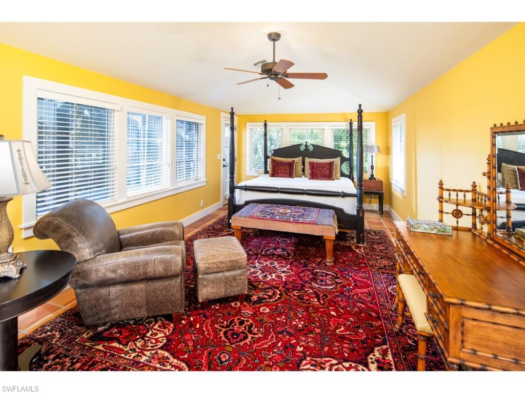 263 10th Avenue South Naples, FL 34102 - Photo 9 of 18 a living room with furniture and a large window
