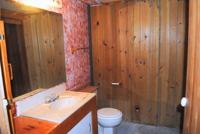 a bathroom with a sink and toilet