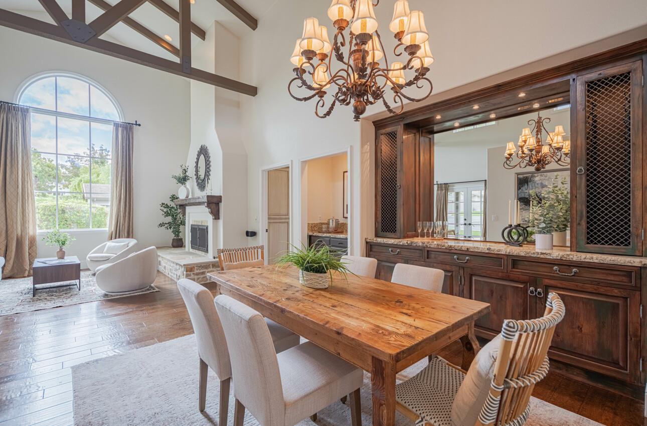 25603 Creekview Circle Salinas, CA 93908 - Photo 14 of 66 a view of a dining room with furniture wooden floor and chandelier