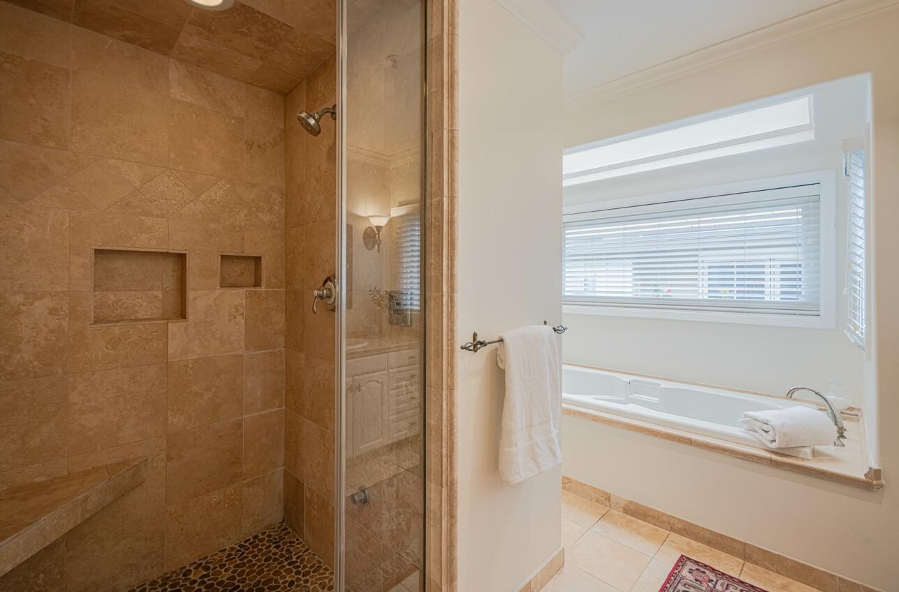 25603 Creekview Circle Salinas, CA 93908 - Photo 40 of 66 a bathroom with a bathtub and a shower
