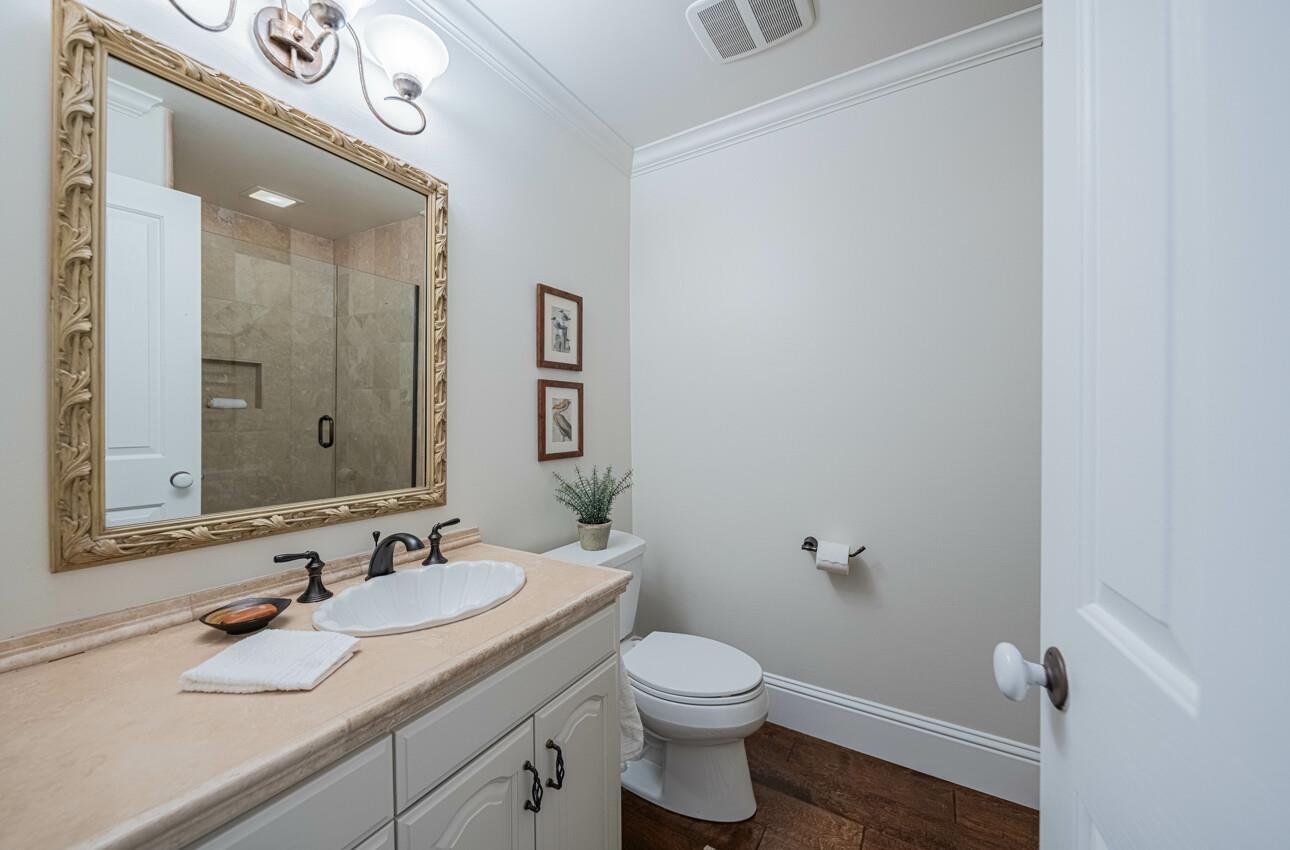 25603 Creekview Circle Salinas, CA 93908 - Photo 44 of 66 a bathroom with a granite countertop sink mirror and toilet
