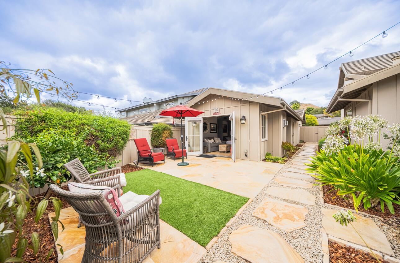 25603 Creekview Circle Salinas, CA 93908 - Photo 52 of 66 a patio with a table and chairs and potted plants