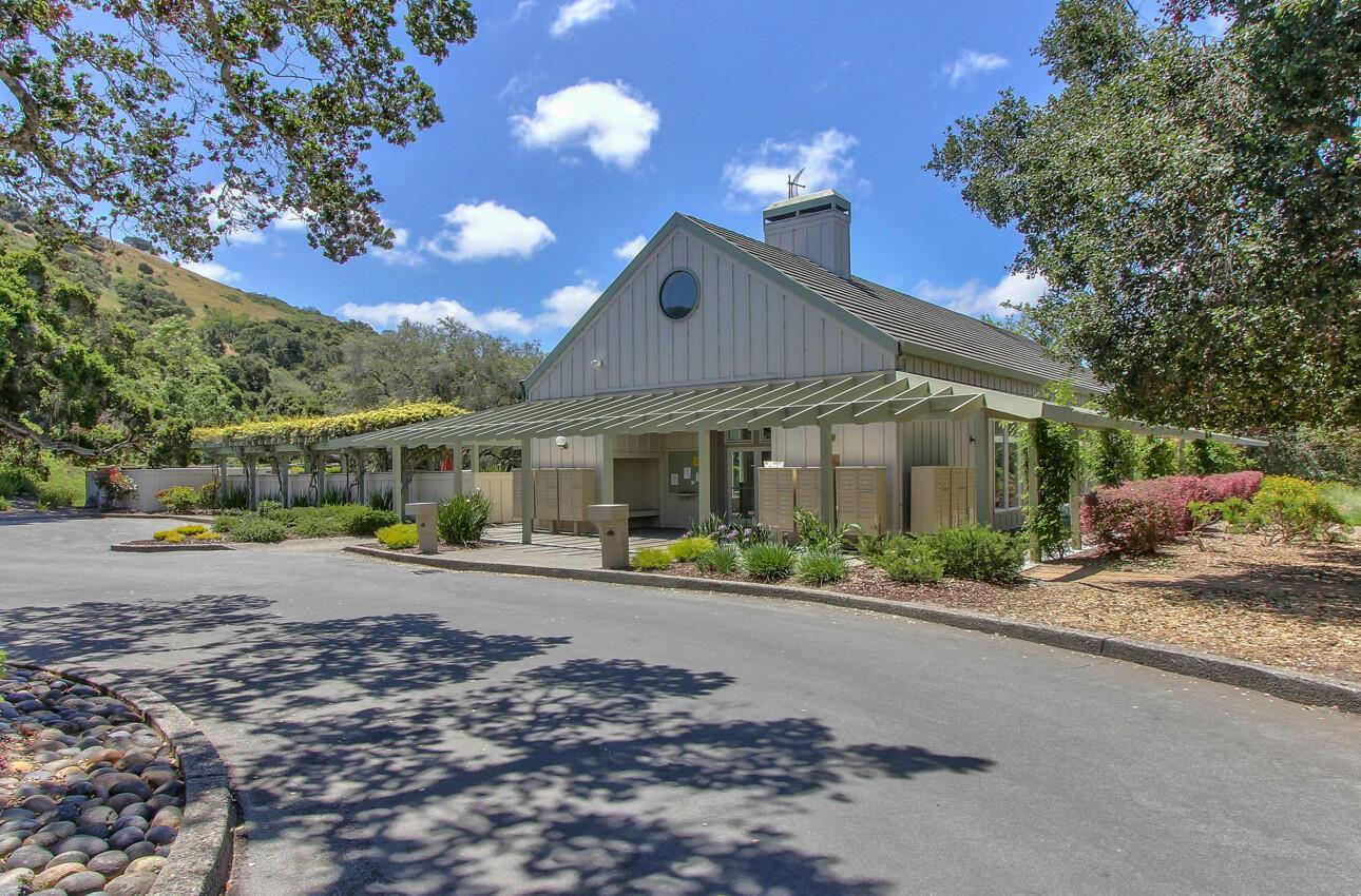 25603 Creekview Circle Salinas, CA 93908 - Photo 64 of 66 a patio with a table and chairs under an umbrella