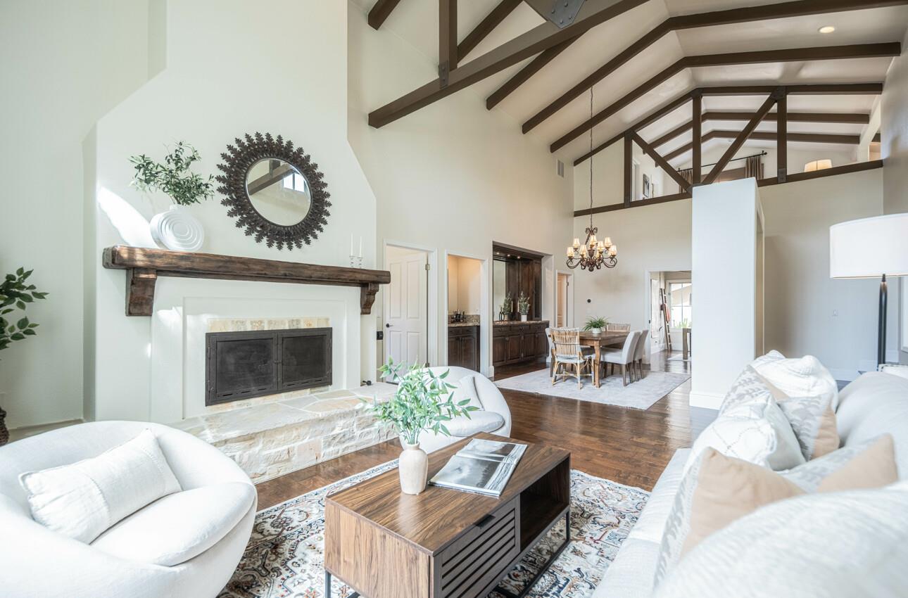 25603 Creekview Circle Salinas, CA 93908 - Photo 10 of 66 a living room with furniture a fireplace and a dining table