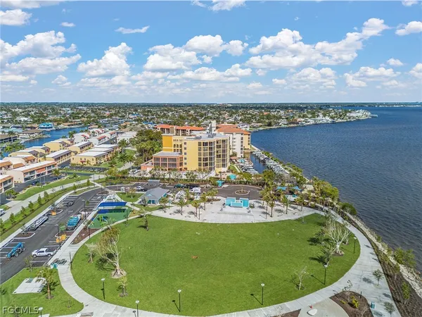 a view of a lake in a big yard
