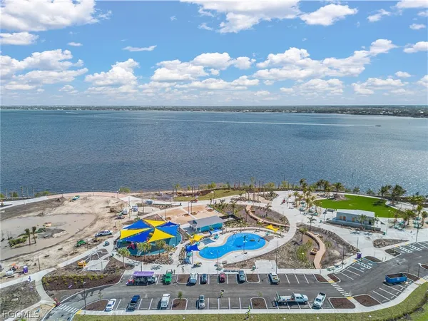 a view of a swimming pool with an outdoor seating