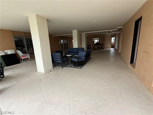 a view of living room with furniture and wooden floor