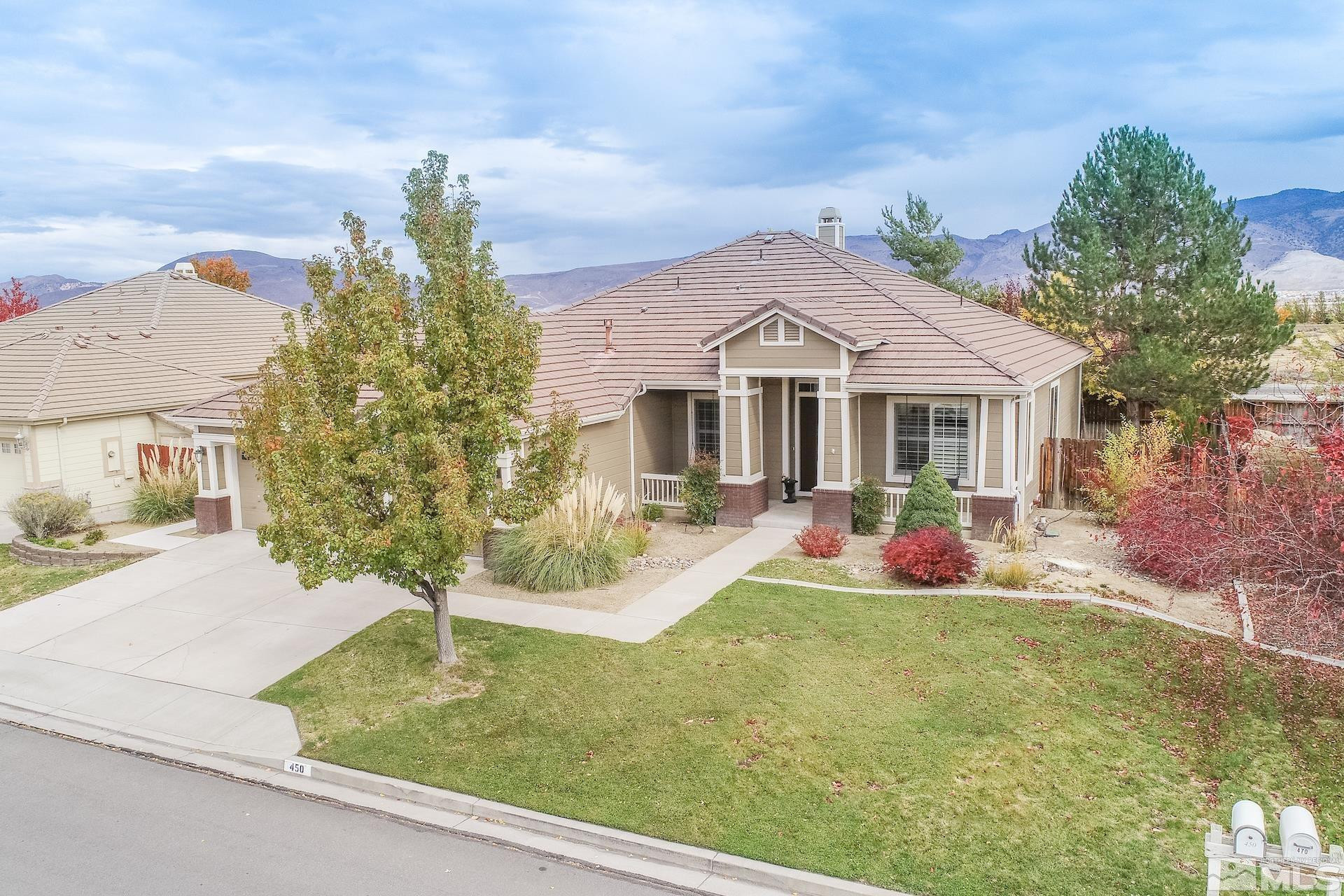 450 Flanders Road Reno, NV 89511 - Photo 3 of 36 a front view of a house with garden