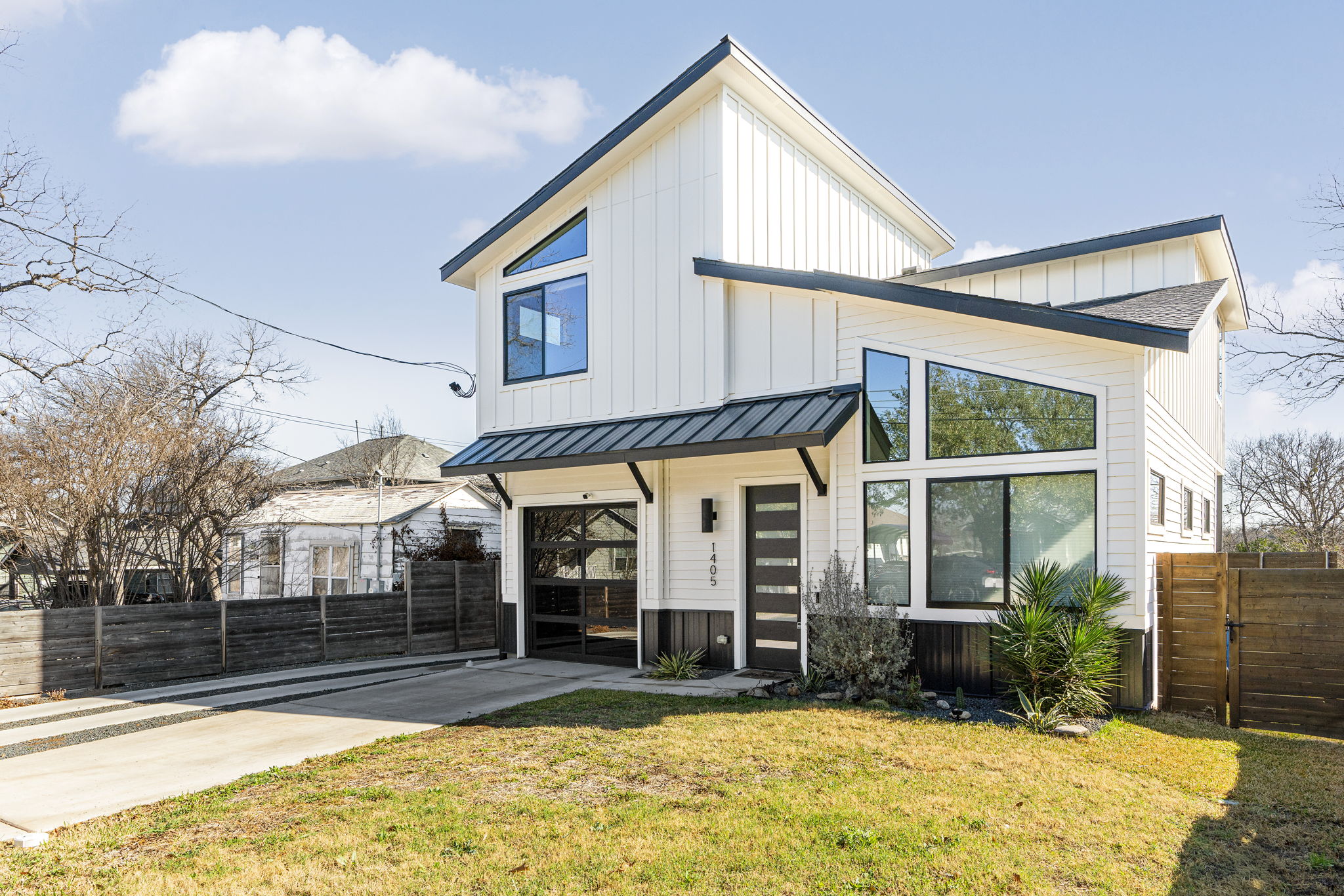 1405 Perez Street, Unit 1 Austin, TX 78721 - Photo 2 of 30 Clean lines, contrasting trim, and a single-car garage create strong curb appeal.
