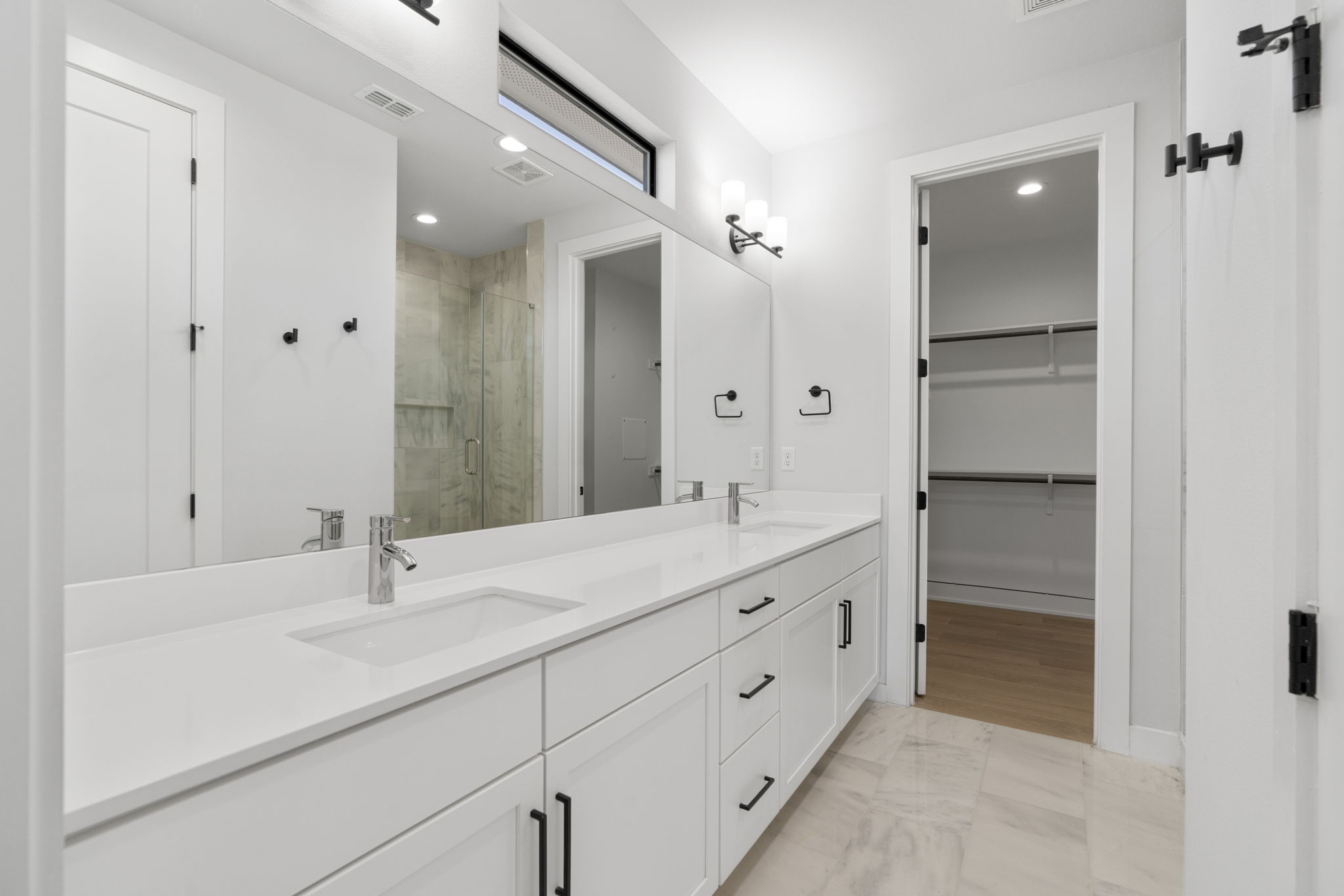 1405 Perez Street, Unit 1 Austin, TX 78721 - Photo 21 of 31 Extended dual vanity offers ample storage and counter space. Direct access to one of two primary closets.