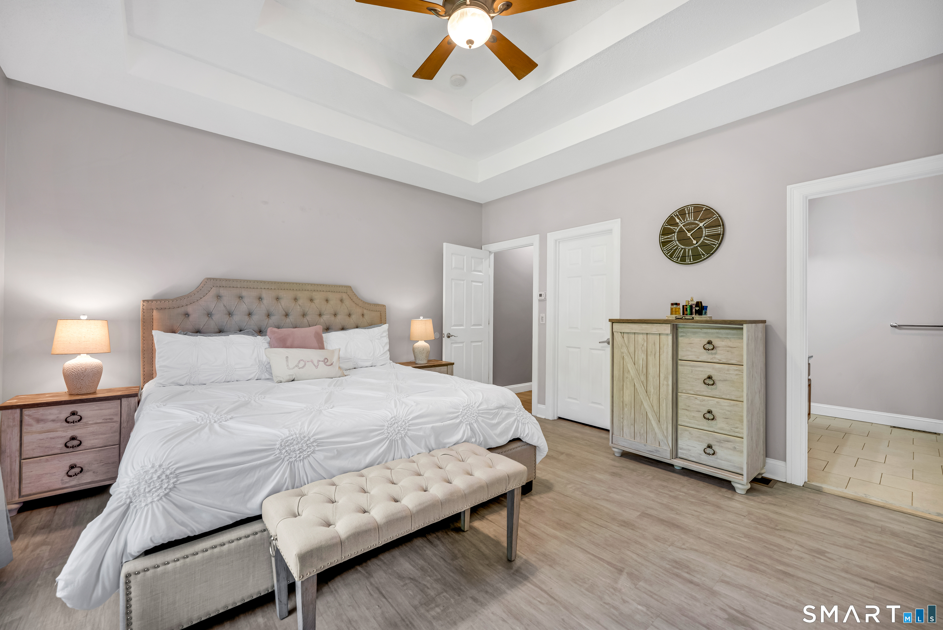 409 Beckley Road Berlin, CT 06037 - Photo 14 of 39 a bedroom with a bed and a ceiling fan