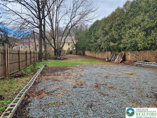 a view of backyard with green space