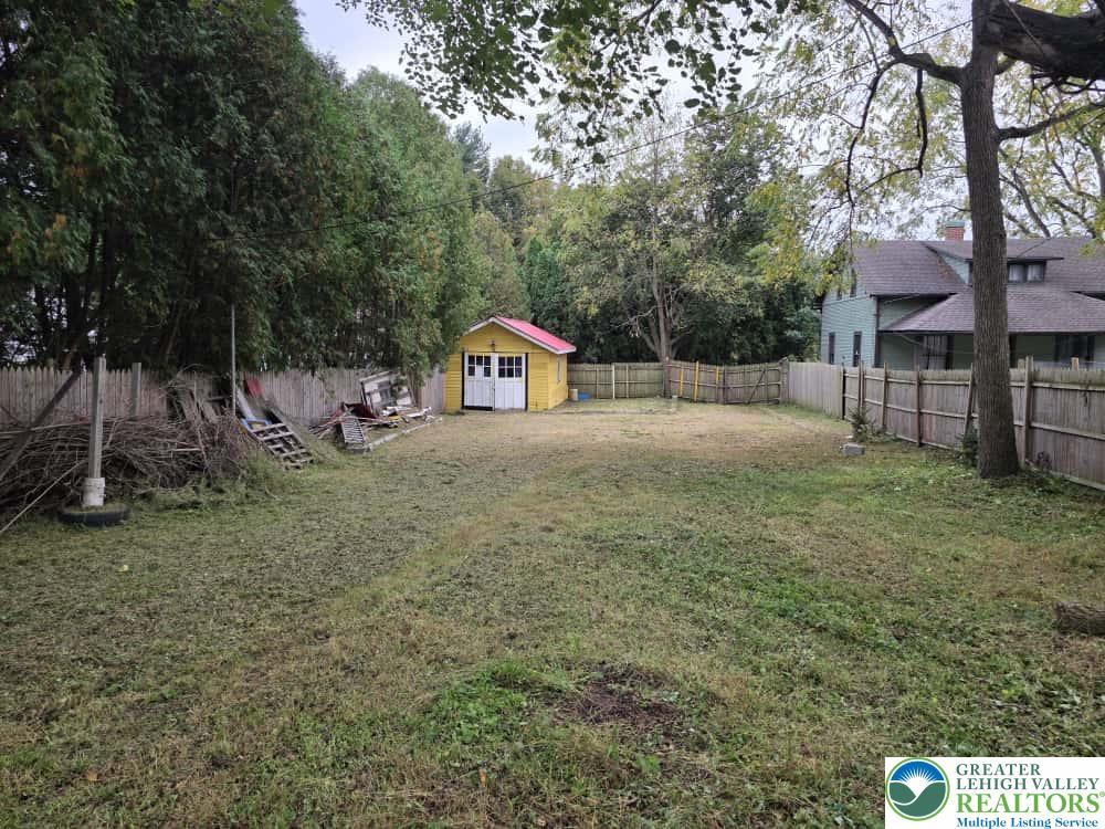1519 Friedensburg Road Reading, PA 19606 - Photo 17 of 24 a backyard of a house with large trees and entertaining space