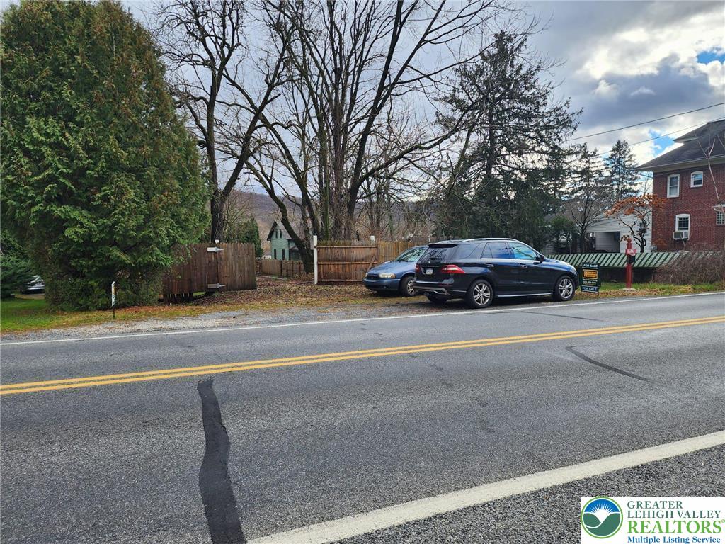 1519 Friedensburg Road Reading, PA 19606 - Photo 21 of 24 a yellow house with trees in front of it
