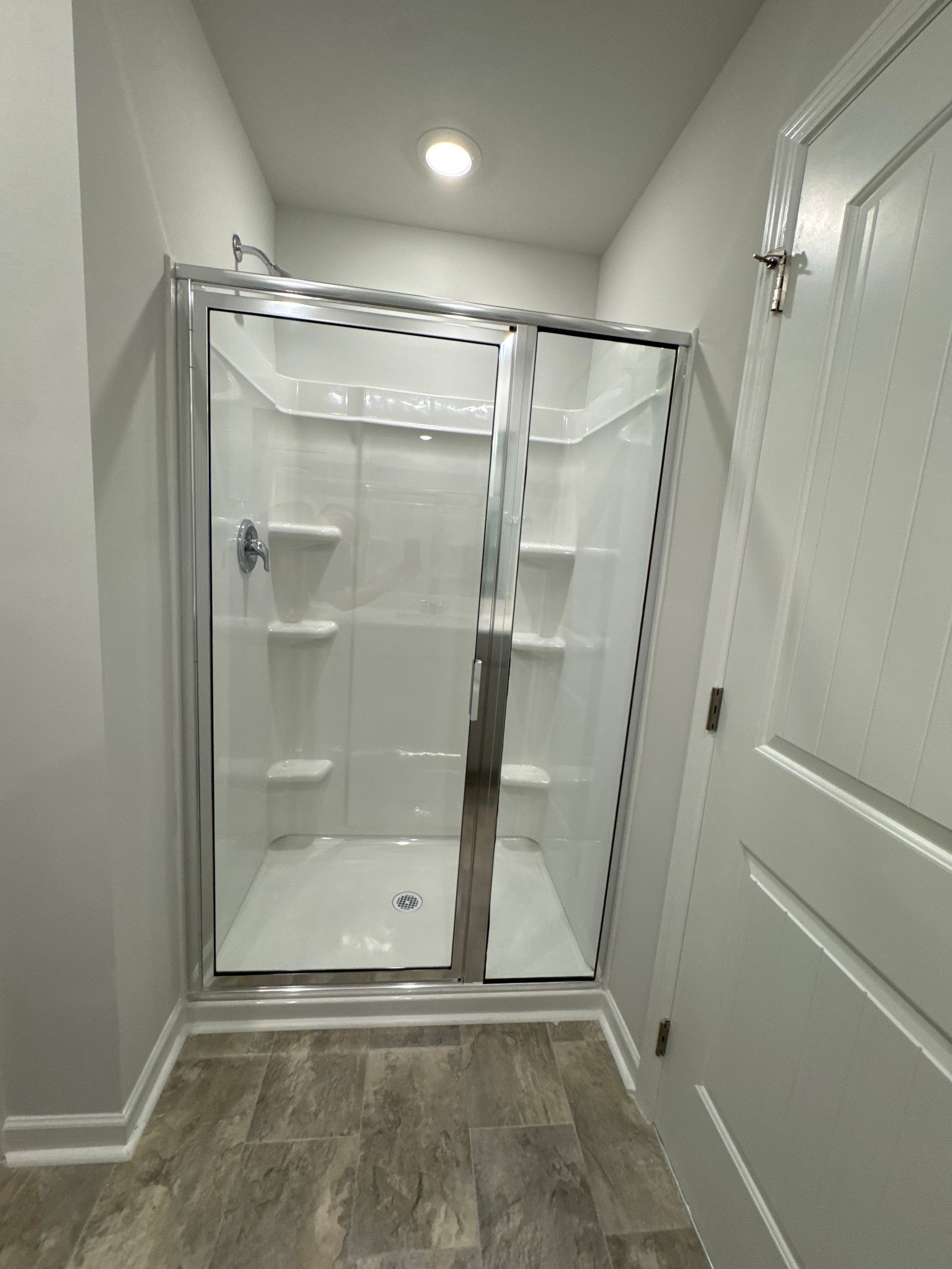 905 Highfield Way Lebanon, TN 37087 - Photo 14 of 15 a bathroom with a glass shower door