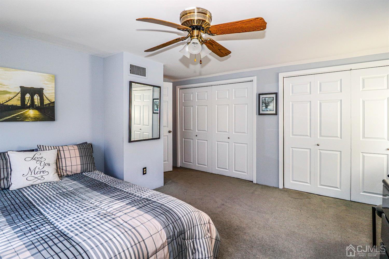 3 Avon Road Edison, NJ 08817 - Photo 22 of 39 a bedroom with a bed and a chandelier