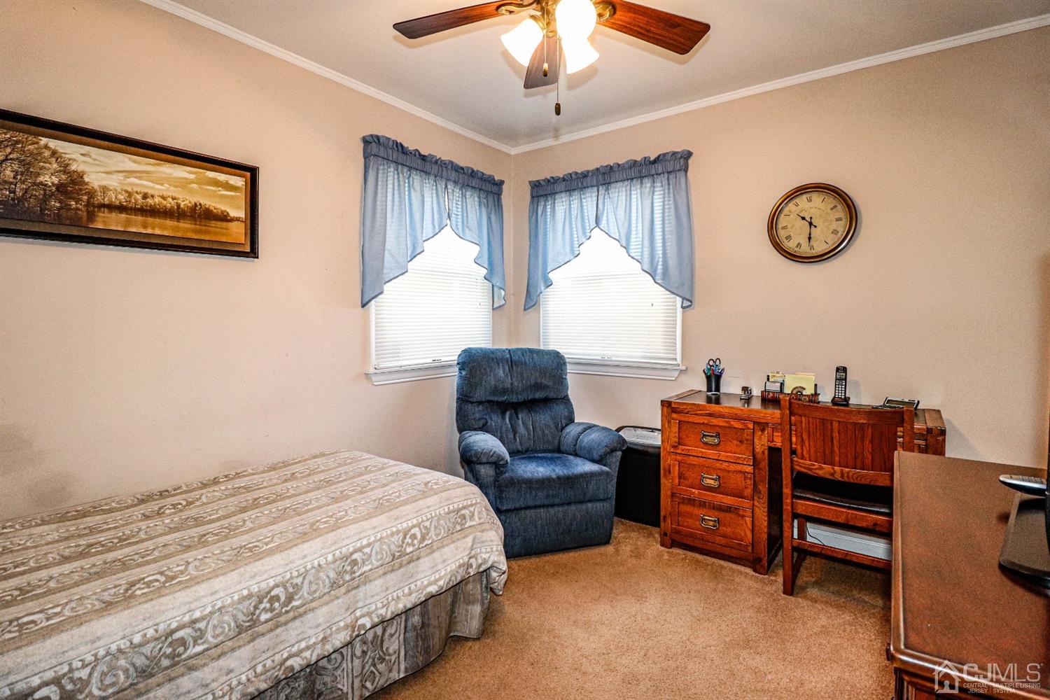 3 Avon Road Edison, NJ 08817 - Photo 24 of 39 a spacious bedroom with a bed and a chandelier
