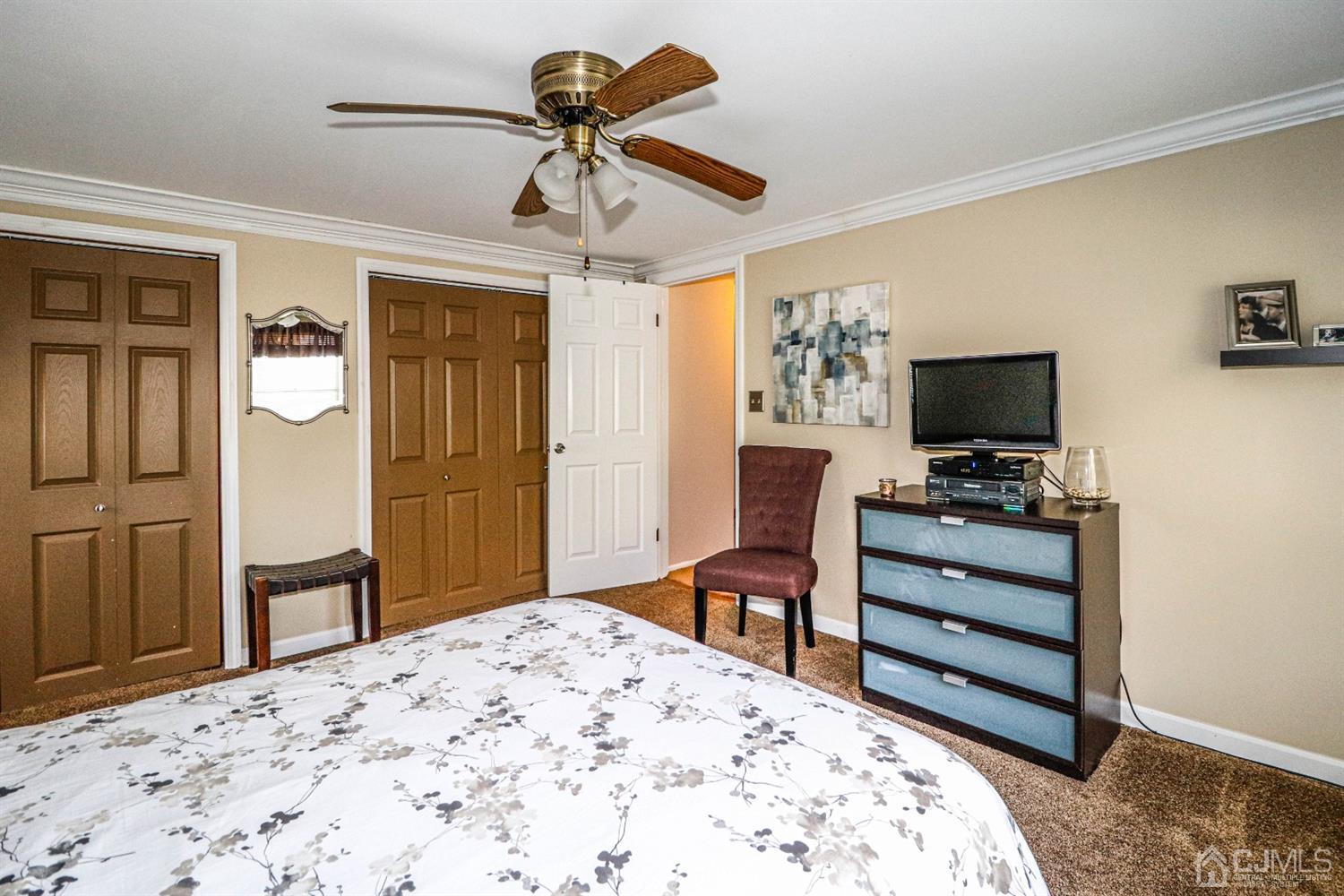 3 Avon Road Edison, NJ 08817 - Photo 28 of 39 a bedroom with a bed and a flat screen tv