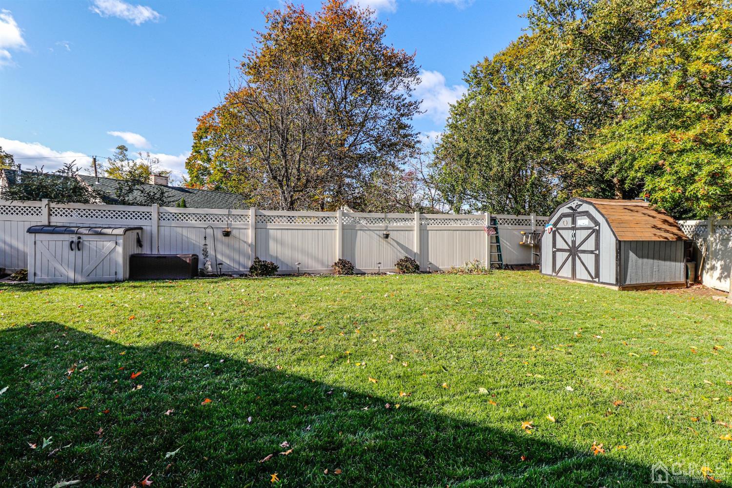 3 Avon Road Edison, NJ 08817 - Photo 34 of 39 a view of a backyard with a garden and tree