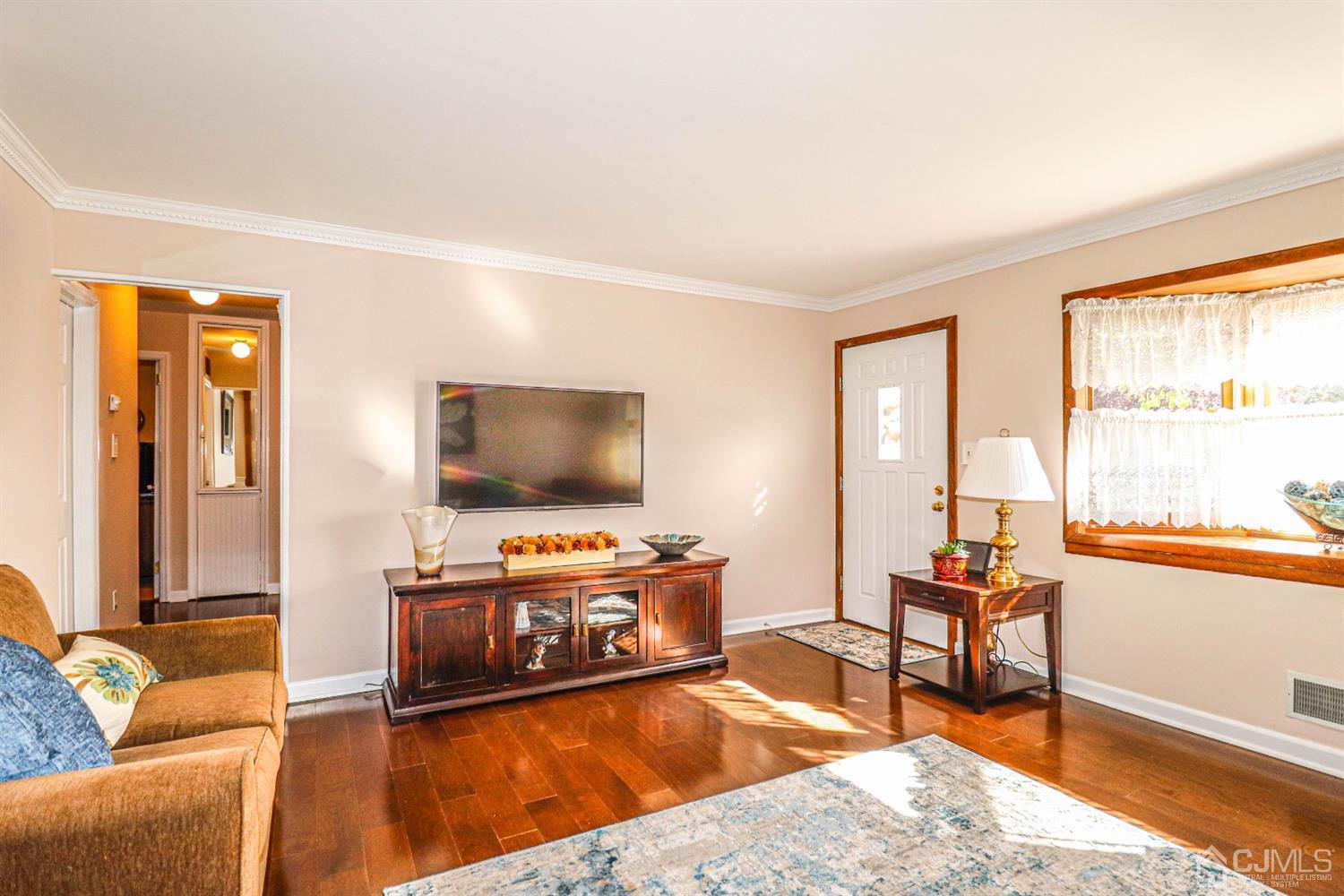 3 Avon Road Edison, NJ 08817 - Photo 7 of 39 a living room with furniture and a flat screen tv