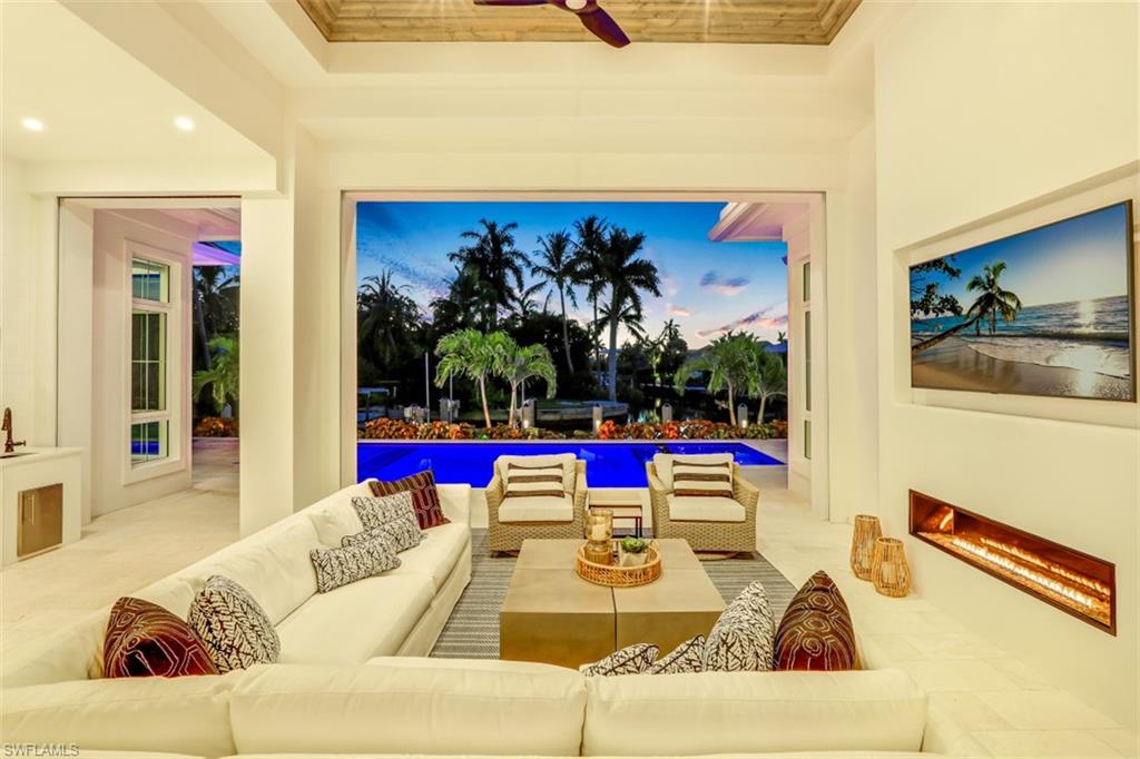2130 Tarpon Road Naples, FL 34102 - Photo 11 of 35 a living room with furniture and white walls