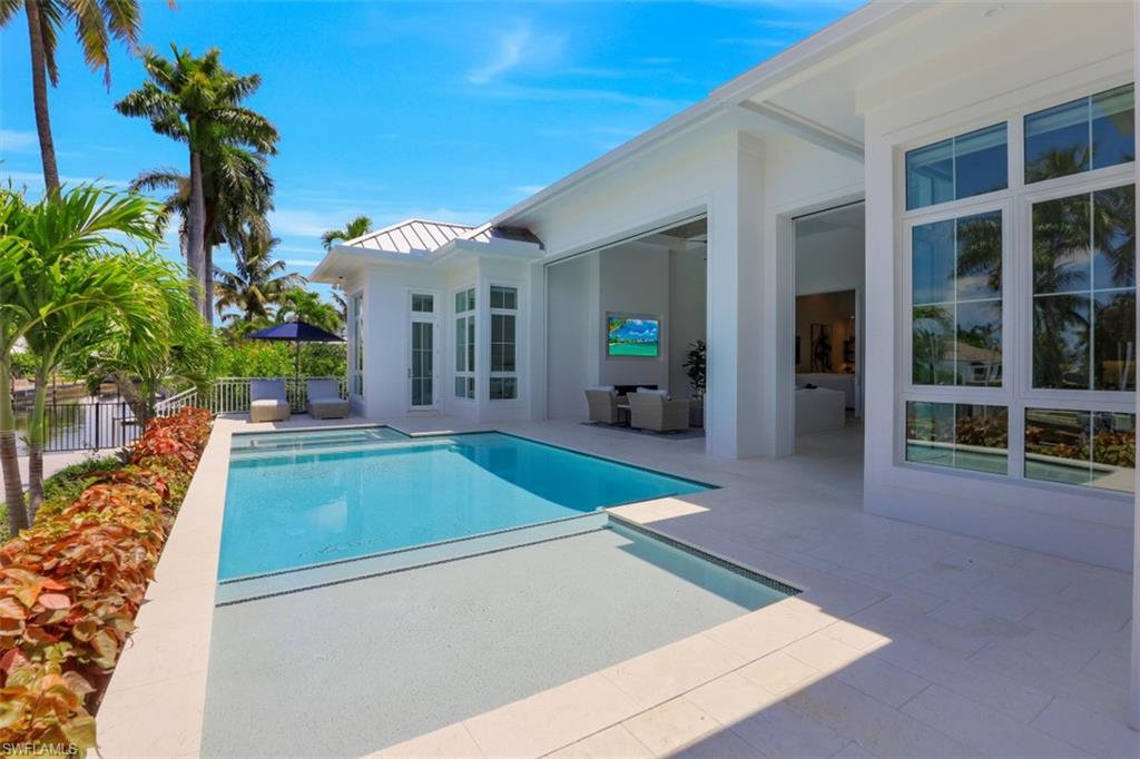 2130 Tarpon Road Naples, FL 34102 - Photo 13 of 35 a view of a house with backyard and sitting area