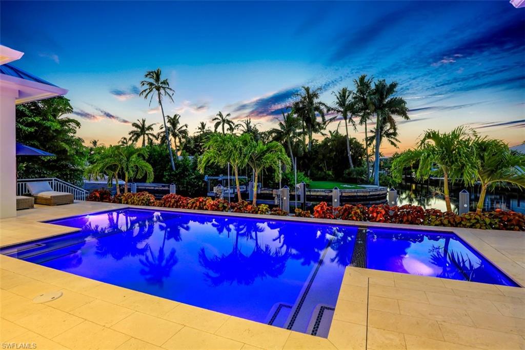 2130 Tarpon Road Naples, FL 34102 - Photo 2 of 35 a view of swimming pool with sitting area