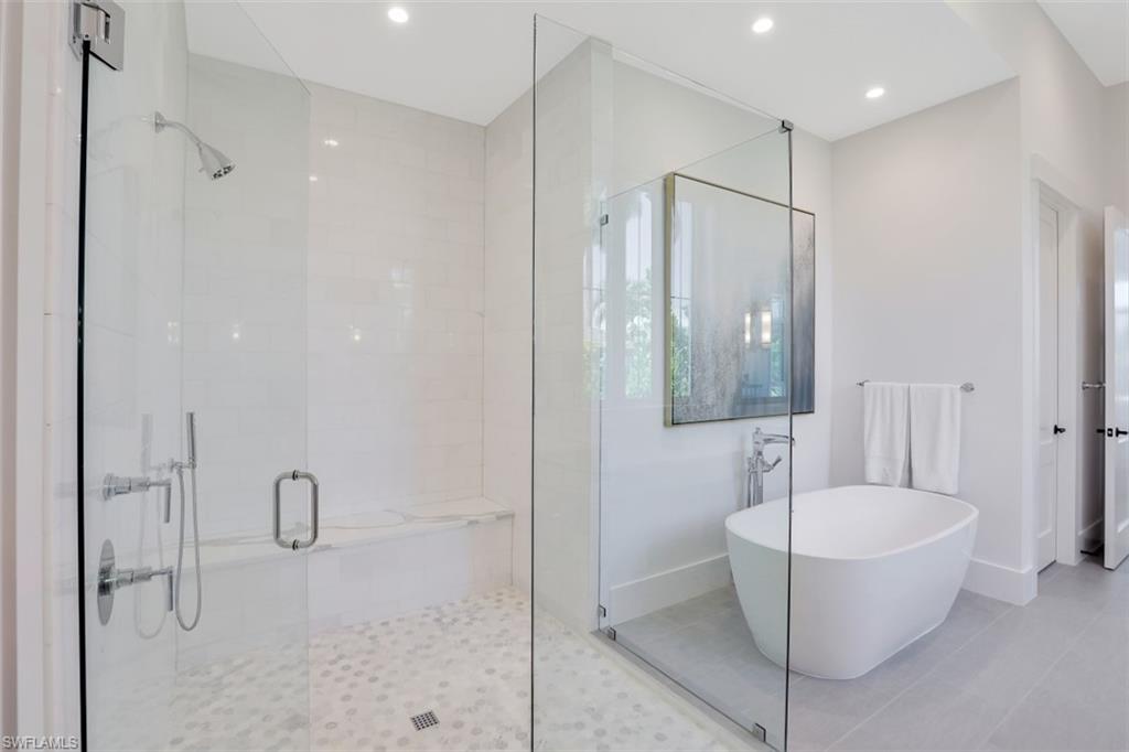 2130 Tarpon Road Naples, FL 34102 - Photo 22 of 35 a bathroom with a bathtub and shower