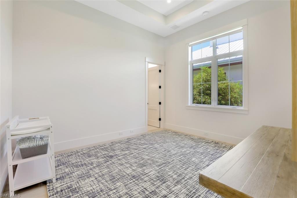 2130 Tarpon Road Naples, FL 34102 - Photo 28 of 35 a view of a bedroom with a bed and a window
