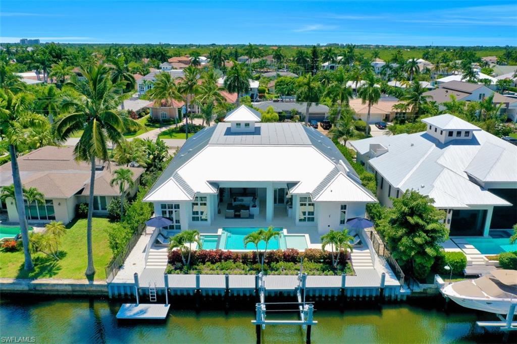 2130 Tarpon Road Naples, FL 34102 - Photo 3 of 35 an aerial view of a house with swimming pool patio and outdoor seating