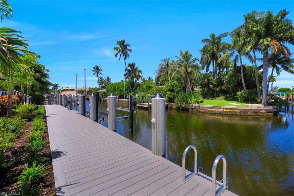 2130 Tarpon Road Naples, FL 34102 - Photo 32 of 35 a lake view with a wooden bridge