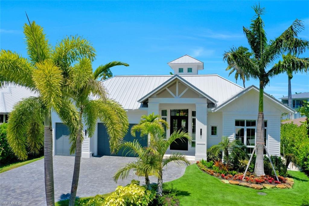 2130 Tarpon Road Naples, FL 34102 - Photo 35 of 35 a front view of a house with garden
