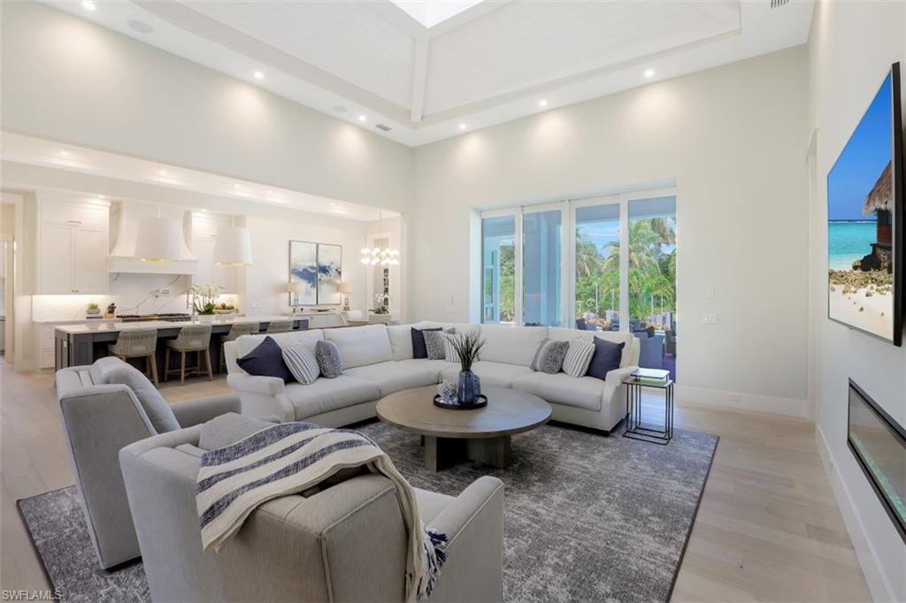 2130 Tarpon Road Naples, FL 34102 - Photo 7 of 35 a living room with furniture and a large window