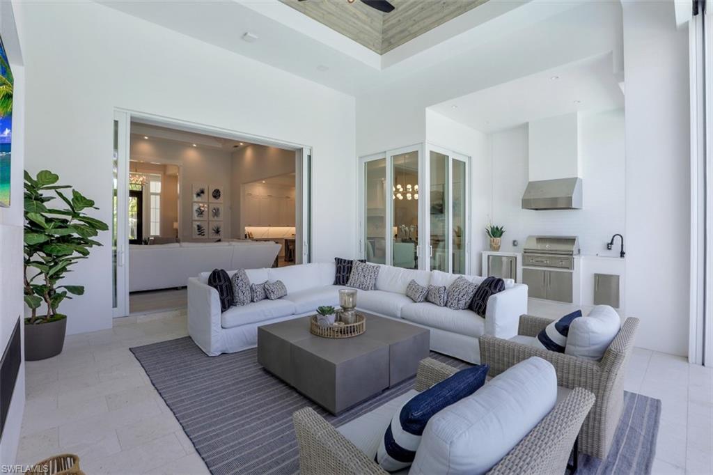 2130 Tarpon Road Naples, FL 34102 - Photo 8 of 35 a living room with furniture and a potted plant