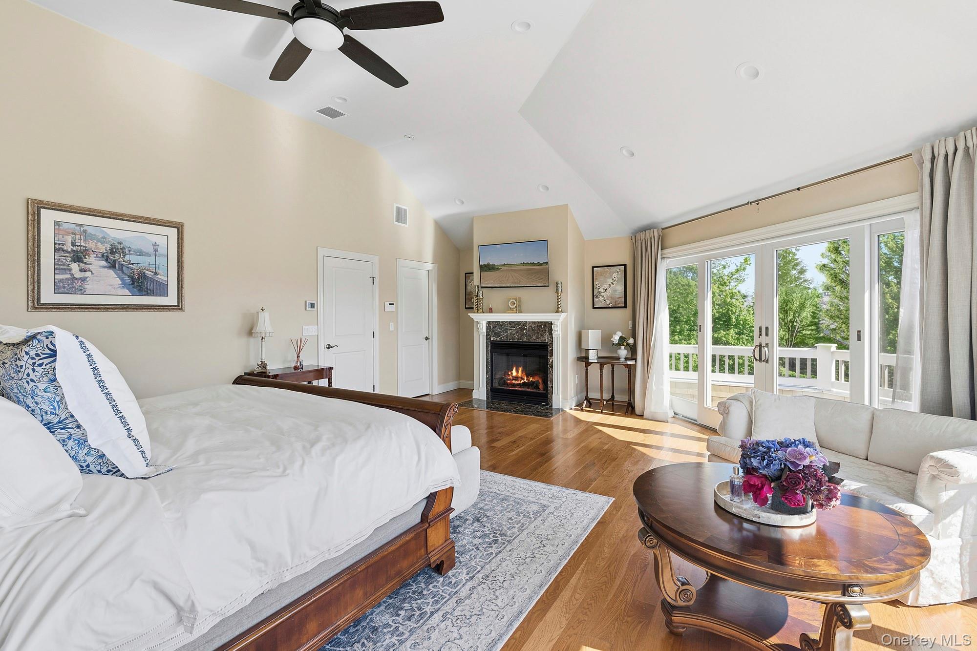 5 Woodcock Lane Remsenburg, NY 11960 - Photo 15 of 23 a spacious bedroom with a bed and a table